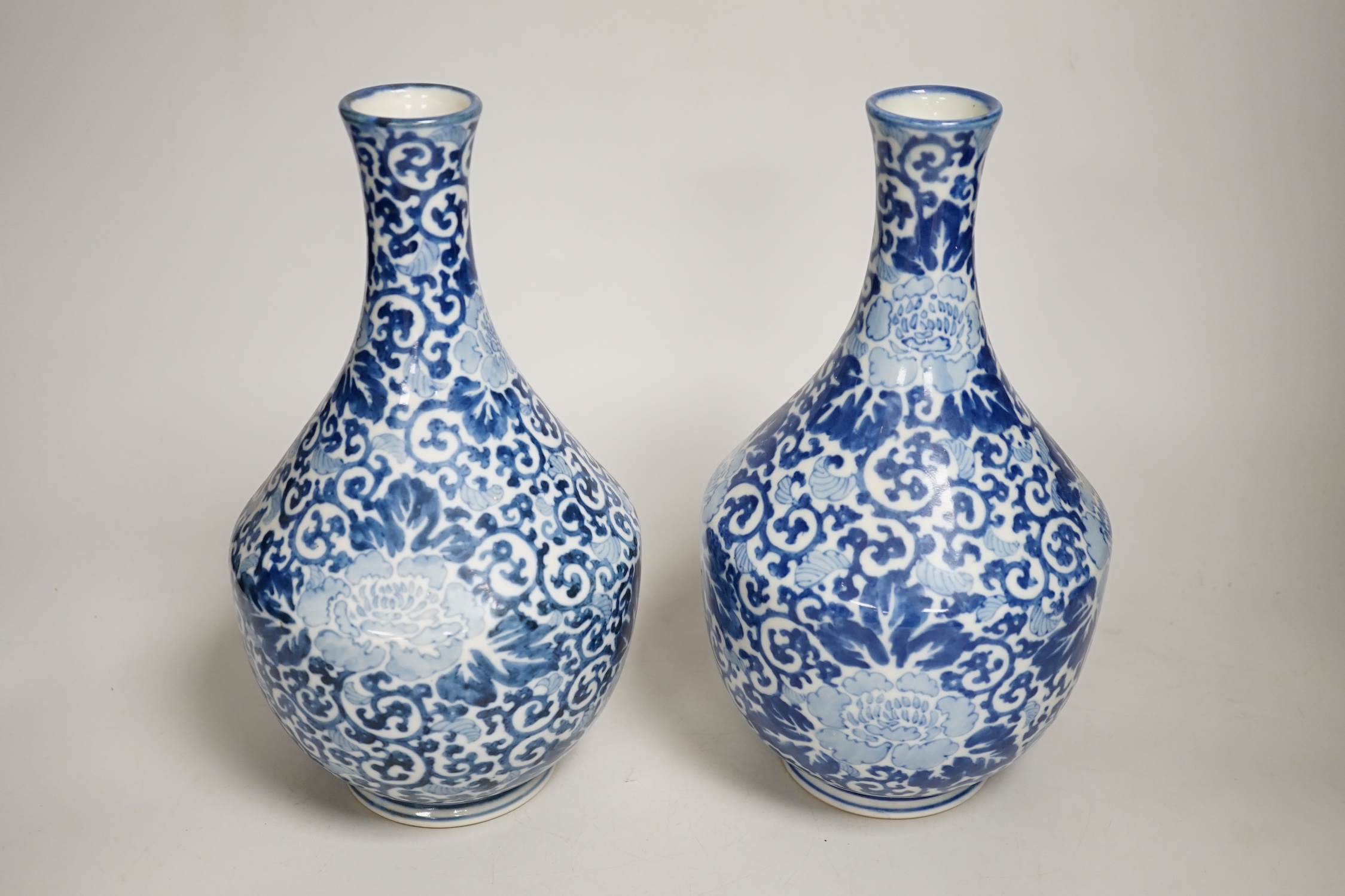A pair of Chinese blue and white vases, 26cm high